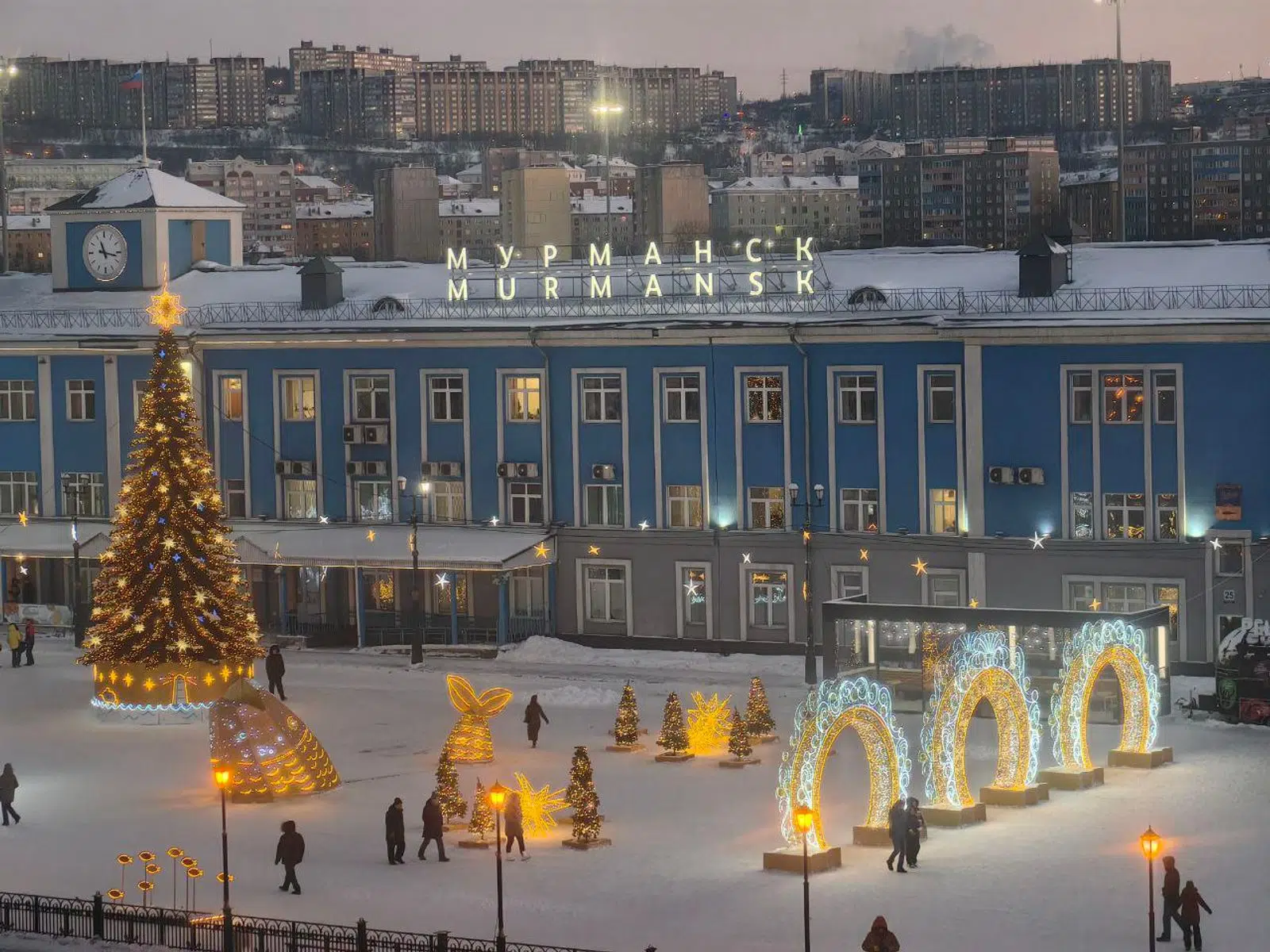 Murmansk railway station square decorated with winter lights