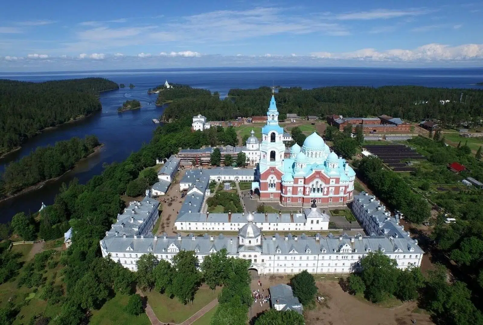 Aerial view of Valaam Monastery surrounded by forest and water